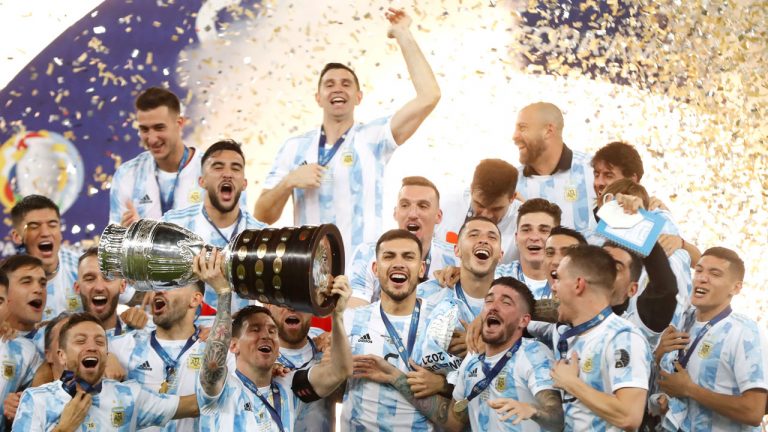 Argentina's players celebrate with the trophy after beating 1-0 Brazil in the Copa America final soccer match at the Maracana stadium in Rio de Janeiro. (Andre Penner/AP)