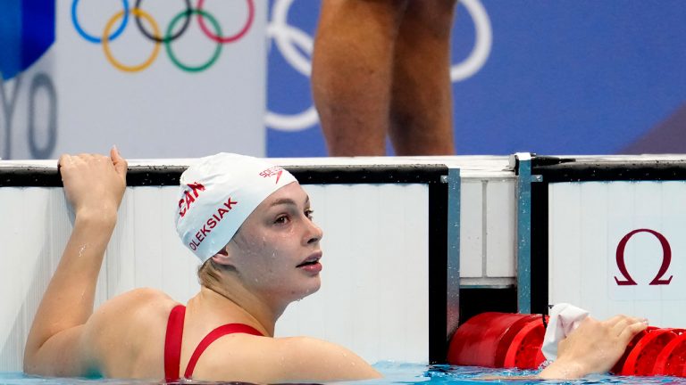 Canada's Penny Oleksiak looks at her results in the women's 200m freestyle semifinal event during the Tokyo Summer Olympic Games. (Frank Gunn/CP)