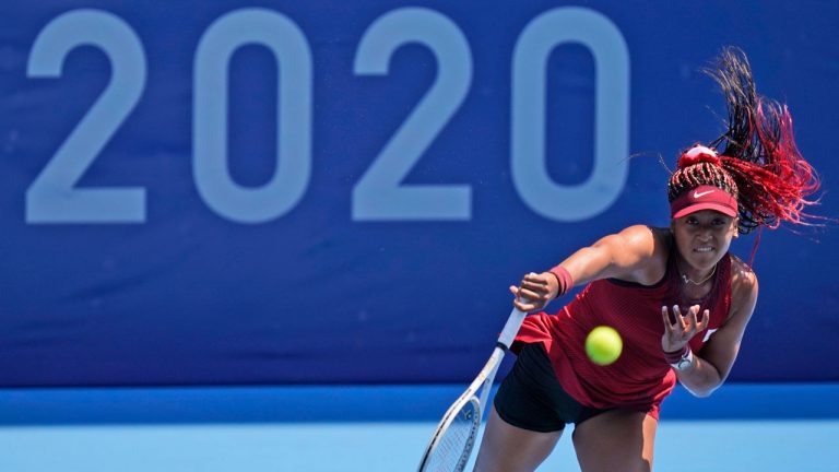 Naomi Osaka, of Japan, plays against Saisai Zheng, of China, during the first round of the tennis competition at the 2020 Summer Olympics. (Seth Wenig/AP) 