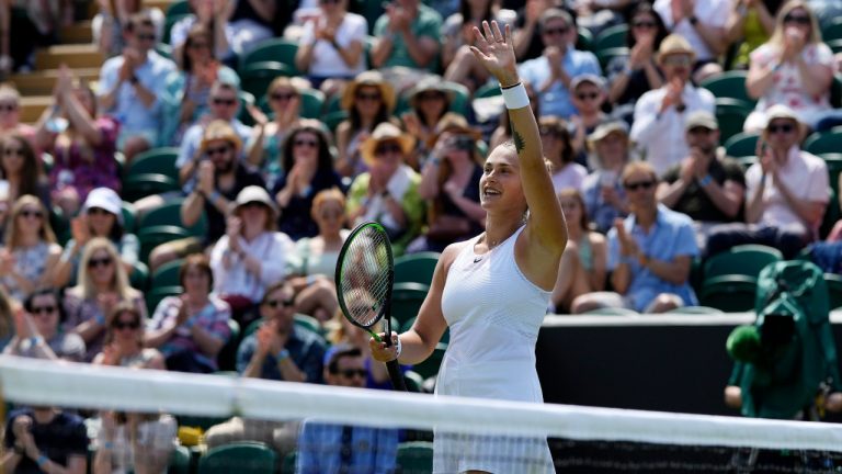 Belarus's Aryna Sabalenka celebrates winning the women's singles third round match against Colombia's Maria Camila Osorio Serrano on day five of the Wimbledon Tennis Championships in London, Friday July 2, 2021. (Alastair Grant/AP) 