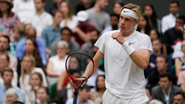 Canada's Denis Shapovalov against Serbia's Novak Djokovic during the men's singles semifinals match on day eleven of the Wimbledon Tennis Championships in London, Friday, July 9, 2021. (Alberto Pezzali/AP)