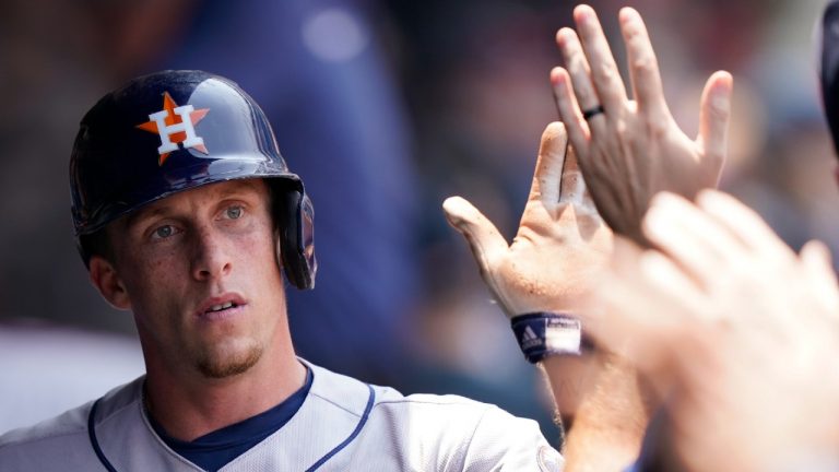 Houston Astros' Myles Straw is congratulated by teammates after scoring in the fourth inning of a baseball game against Cleveland, Sunday, July 4, 2021. (Tony Dejak/AP) 