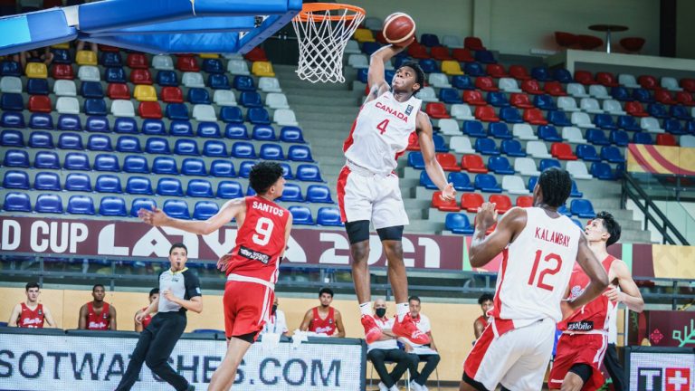 Elijah Fisher of Team Canada rises up for a dunk in U19 competition. (Canada Basketball/Twitter)
