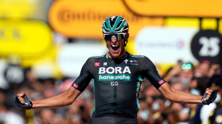 German Nils Politt celebrates as he crosses the finish line to win the twelfth stage of the Tour de France cycling race over 159.4 kilometers (99 miles) with start in Saint-Paul-Trois-Chateaux and finish in Nimes, France, Thursday, July 8, 2021. (Daniel Cole/AP)