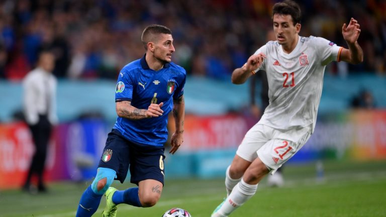 Italy's Marco Verratti, left, takes on Spain's Mikel Oyarzabal during the Euro 2020 semifinal between Italy and Spain at Wembley stadium in London, Tuesday, July 6, 2021. (Laurence Griffiths, Pool via AP)