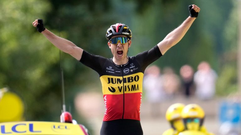 Belgium's Wout Van Aert celebrates as he crosses the finish line to win the eleventh stage of the Tour de France cycling race over 198.9 kilometers (123.6 miles) with start in Sorgues and finish in Malaucene, France, Wednesday, July 7, 2021. (Christophe Ena/AP)