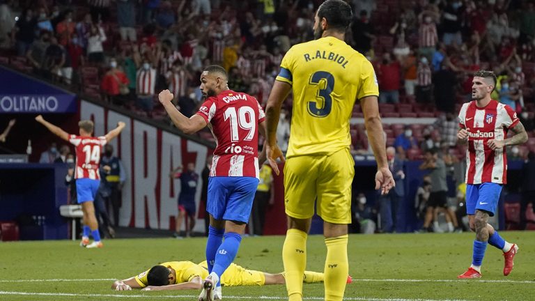 Atletico Madrid's Matheus Cunha, center, celebrates Marcos Llorente's goal during a Spanish La Liga soccer match between Atletico Madrid and Villarreal at the Wanda Metropolitano stadium in Madrid, Spain, Sunday, Aug. 29, 2021. (Andrea Comas/AP)