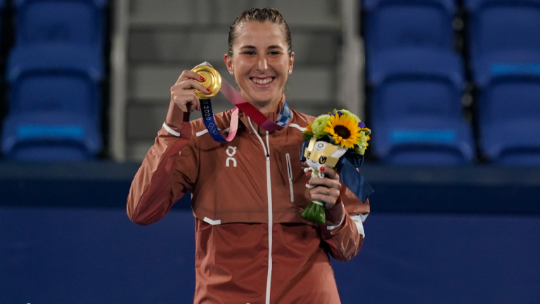 Belinda Bencic, of Switzerland, poses with the gold medal in the women's singles of the tennis competition at the 2020 Summer Olympics, Sunday, Aug. 1, 2021, in Tokyo, Japan. (Seth Wenig/AP)