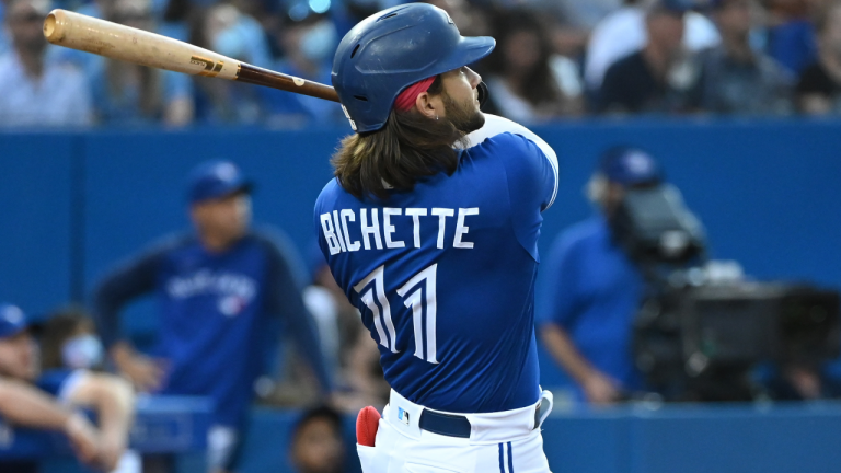 Toronto Blue Jays shortstop Bo Bichette (11) watches his two run home run which scored teammate Vladimir Guerrero Jr. during fourth inning AL baseball game action against the Cleveland Indians in Toronto on Thursday Aug. 5, 2021. (Jon Blacker / CP)