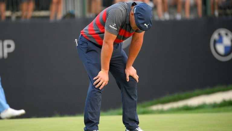 Bryson DeChambeau reacts after missing a putt on the 17th green, the third playoff hole, during the final round of the BMW Championship. (Nick Wass/AP)