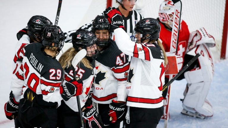 Canada's Jaime Bourbonnais (25) celebrates a goal with teammates during second period IIHF Women's World Championship hockey action against Switzerland in Calgary, Tuesday, Aug. 24, 2021. (Jeff McIntosh/CP)