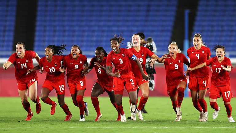 Players of Team Canada celebrate following their team's victory in the penalty shoot out in the Women's Gold Medal Match between Canada and Sweden on day fourteen of the Tokyo 2020 Olympic Games at International Stadium Yokohama on August 06, 2021 in Yokohama, Kanagawa, Japan. (Photo by Francois Nel/Getty Images)