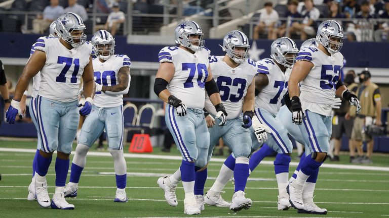 Dallas Cowboys' La'el Collins (71), Tony Pollard (20), Zack Martin (70), Tyler Biadasz (63), Tyron Smith (77) and Connor Williams (52) step up to the line of scrimmage in the first half of a preseason NFL football game against the Houston Texans. (Michael Ainsworth/AP)