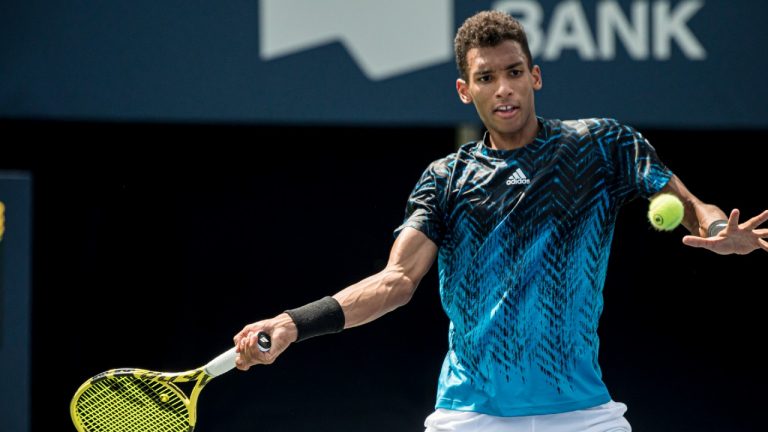 Canada's Felix Auger-Aliassime returns the ball to Serbia's Dusan Lajovic during Men's National Bank Open tennis action, in Toronto on Wednesday, Aug., 11, 2021. (Christopher Katsarov/CP)