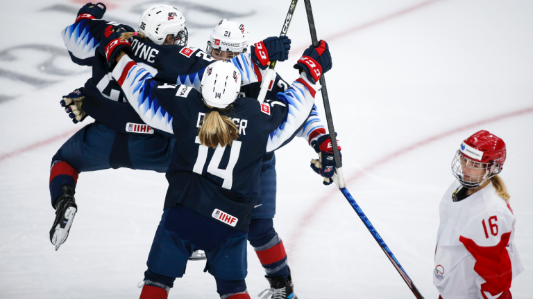 Hilary Knight, centre, of the United States, celebrates her goal with teammates Kendall Coyne Schofield, left, and Brianna Decker as Russia's Ilona Markova looks away during second period IIHF Women's World Championship hockey action in Calgary, Tuesday, Aug. 24, 2021. (Jeff McIntosh / CP)