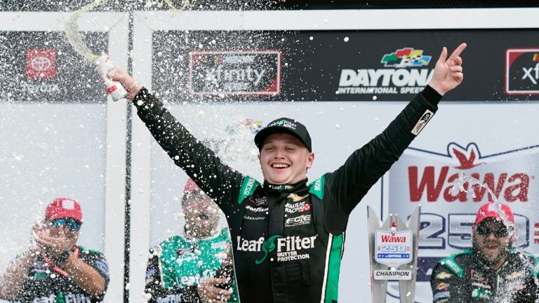 Justin Haley celebrates in Victory Lane after winning the NASCAR Xfinity Series at Daytona International Speedway. (John Raoux/AP)