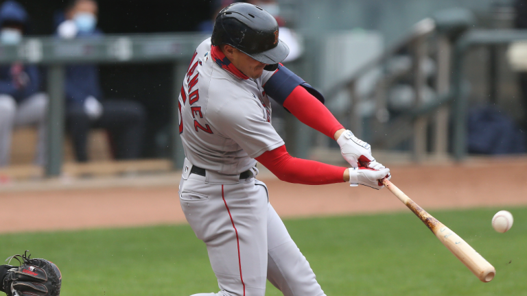 Boston Red Sox Kike Hernandez (5) hits a fly ball during the third inning of a baseball game. (Stacy Bengs/AP)