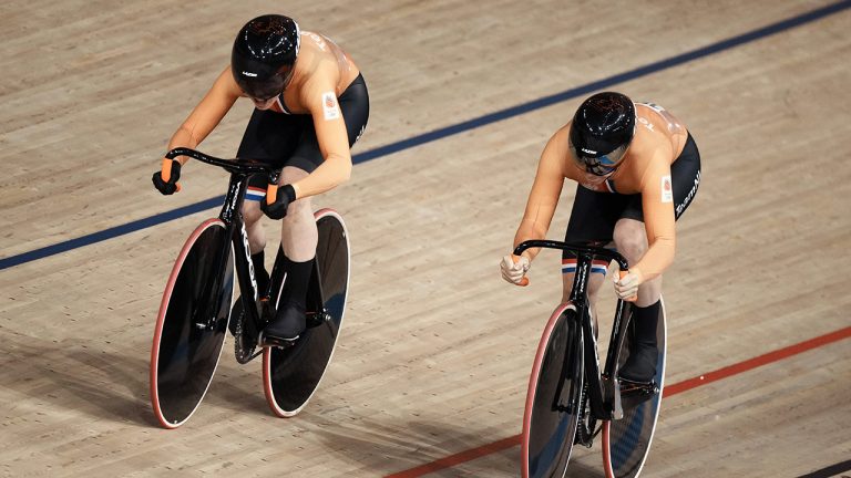 Laurine van Riessen, left, and Shanne Braspennincx of Team Netherlands compete in the track cycling women's team sprint at the 2020 Summer Olympics. (Thibault Camus/AP)