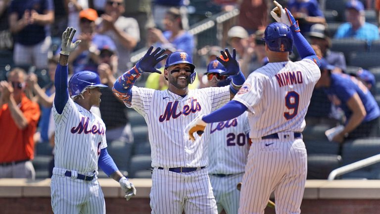 New York Mets' Marcus Stroman, left, and Jonathan Villar, center, greet Brandon Nimmo (9) after he hit a three-run homer during the second inning of a baseball game against the Washington Nationals. (Seth Wenig/AP)