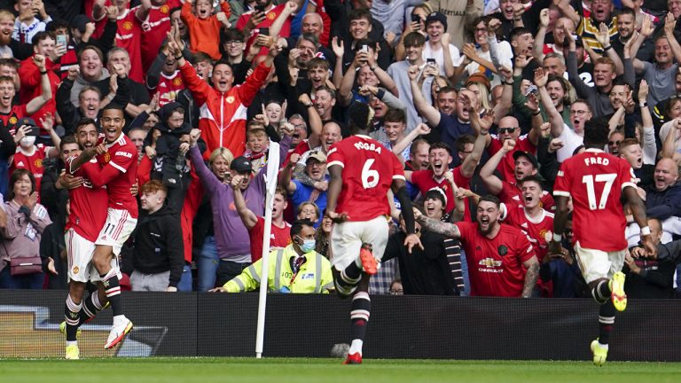 Manchester United's Bruno Fernandes, left, celebrates with teammates after scoring his team's first goal. (Jon Super/AP)