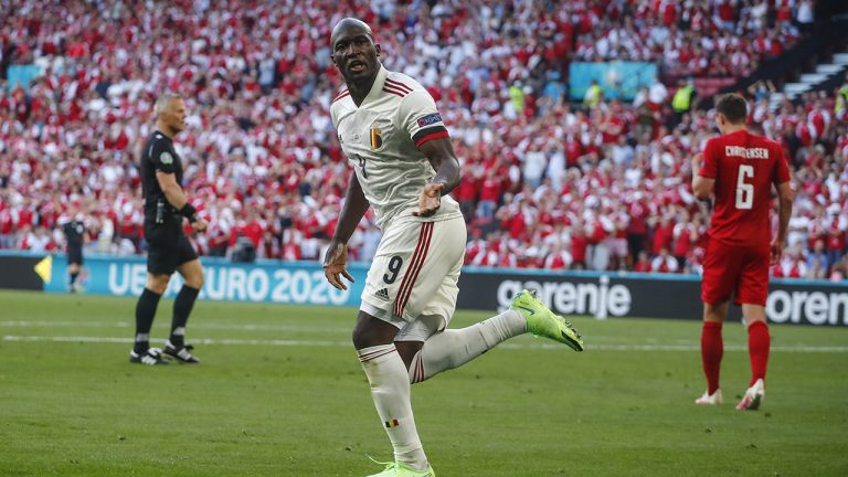 Belgium's Romelu Lukaku celebrates after his teammate Thorgan Hazard scored his side's opening goal during the Euro 2020 soccer championship group B match between Denmark and Belgium, at the Parken stadium in Copenhagen, Thursday, June 17, 2021. (Wolfgang Rattay, Pool via AP)