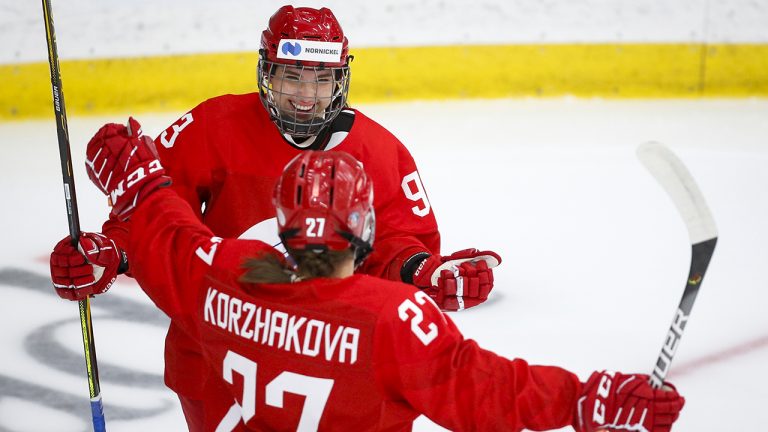 Russian Olympic Committee's Yelizaveta Rodnova, left, celebrates her goal with teammate Veronika Korzhakova. (Jeff McIntosh/CP)