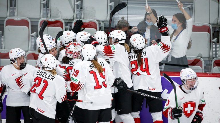Switzerland celebrate defeating Russian Olympic Committee during overtime quarterfinal IIHF Women's World Championship hockey action in Calgary, Alta., Saturday, Aug. 28, 2021. (Jeff McIntosh/CP)