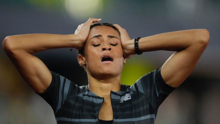 Sydney McLaughlin reacts after setting a new world record in the finals of the women's 400-meter hurdles at the U.S. Olympic Track and Field Trials Sunday, June 27, 2021, in Eugene, Ore. (Ashley Landis / AP) 