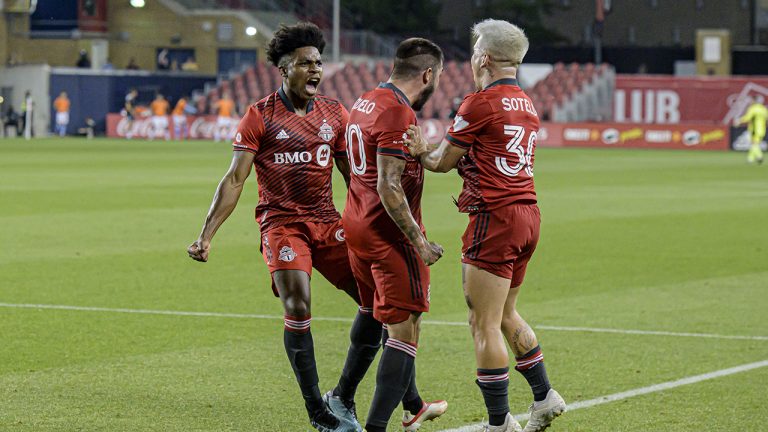 Toronto FC's Ralph Priso (97), Alejandro Pozuelo (10) and Yeferson Soteldo (30) celebrate after teammate Alejandro Pozuelo, not shown, scored to tie against New York City during second half MLS soccer action in Toronto on Saturday,  August 7, 2021. (Chris Katsarov/CP)