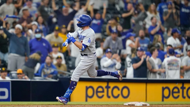 Los Angeles Dodgers' AJ Pollock reacts after hitting a two-run home run during the sixteenth inning of a baseball game against the San Diego Padres, Thursday, Aug. 26, 2021, in San Diego. (Gregory Bull/AP) 
