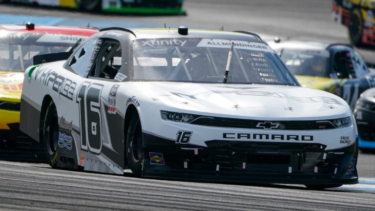 AJ Allmendinger (16) drives through the second turn during the NASCAR Xfinity Series auto race at Indianapolis Motor Speedway in Indianapolis, Saturday, Aug. 14, 2021. (Michael Conroy/AP)