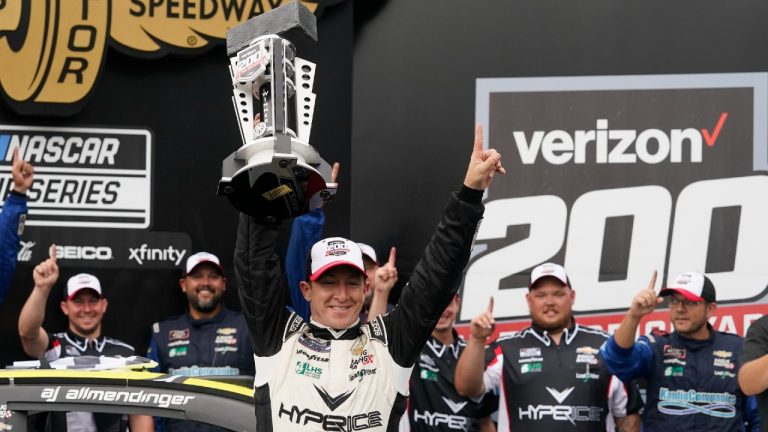 AJ Allmendinger celebrates after winning the NASCAR Series auto race at Indianapolis Motor Speedway, Sunday, Aug. 15, 2021, in Indianapolis. (Darron Cummings/AP)