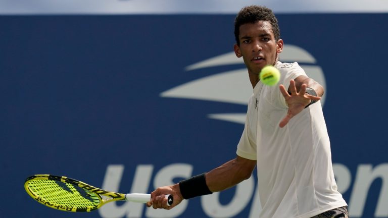 Felix Auger-Aliassime, of Canada, returns a shot to Evgeny Donskoy, of Russia, during the first round of the US Open tennis championships, Monday, Aug. 30, 2021, in New York. (Seth Wenig/AP)