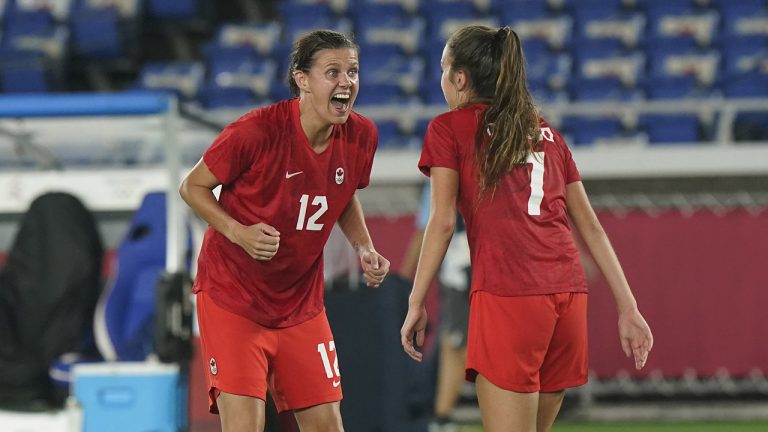 Canada's Christine Sinclair celebrates with Julia Grosso, who scored the winning penalty kick goal during the women's soccer gold medal game at the Tokyo Olympics in Yokohama, Japan, on Aug. 6, 2021. (Adrian Wyld/CP)