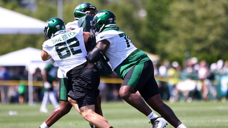 New York Jets offensive lineman Cameron Clark (72) attempts to block Greg Van Roten (62) and Morgan Moses (78) during practice at the team's NFL football training facility, Saturday, July. 31, 2021, in Florham Park, N.J. (Rich Schultz/AP) 