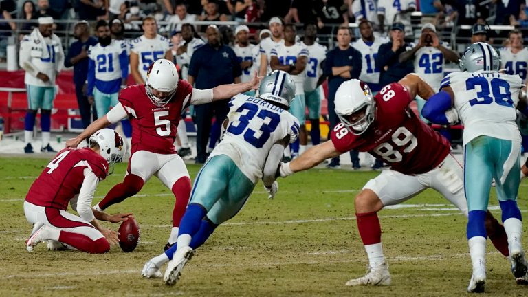 Arizona Cardinals kicker Matt Prater (5) kicks the game-winning field goal as punter Andy Lee (4) holds during the second half of an NFL preseason football game against the Dallas Cowboys. (Ross D. Franklin/AP)