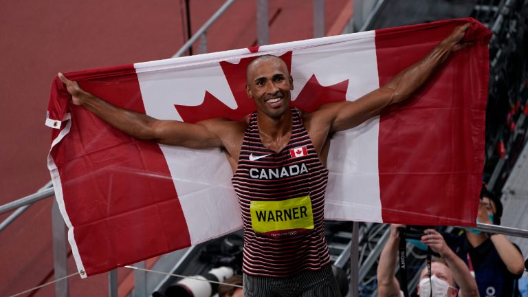 Canada's Damian Warner celebrates his gold medal win in men's decathlon during the Tokyo Olympics in Tokyo, Japan on Thursday, August 5, 2021. (Adrian Wyld/CP)