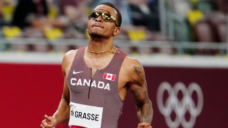 Andre De Grasse of Canada reacts after racing in the Men's 100m event at the summer Olympics in Tokyo. (Frank Gunn/CP)