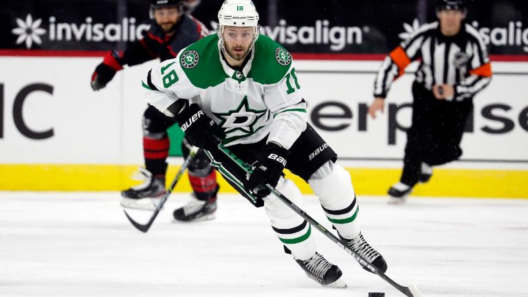 Dallas Stars' Jason Dickinson (18) brings the puck up the ice against the Carolina Hurricanes during the third period of an NHL hockey game in Raleigh, N.C., Saturday, Jan. 30, 2021. (Karl B DeBlaker/AP)