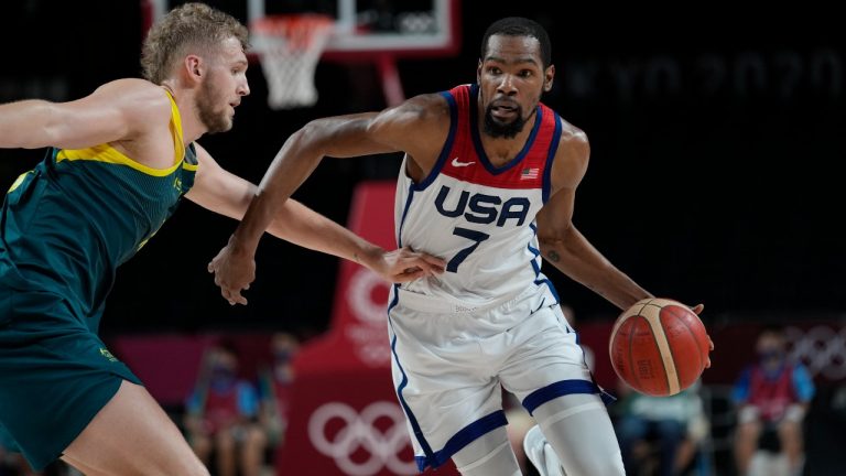 United States's Kevin Durant (7) drives against Australia's Jock Landale (13) during men's basketball semifinal game at the 2020 Summer Olympics, Thursday, Aug. 5, 2021, in Saitama, Japan. (Eric Gay/AP)
