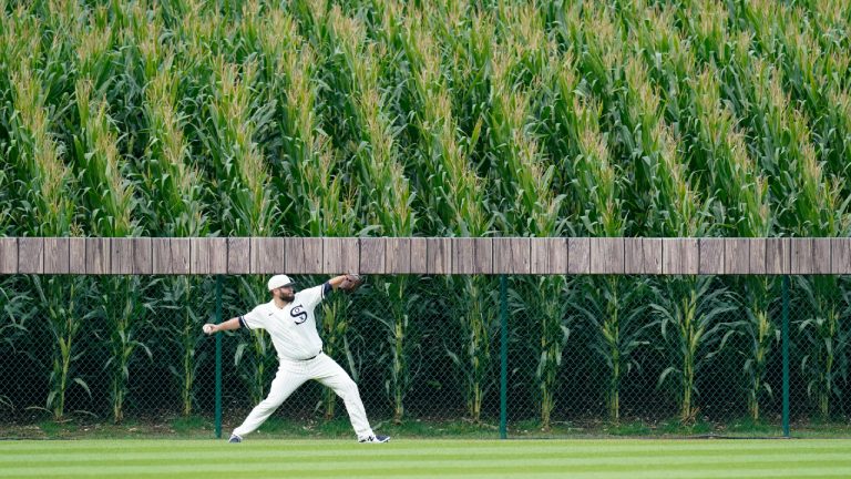 Chicago White Sox pitcher Lance Lynn warms up in the outfield before a baseball game against the New York Yankees, Thursday, Aug. 12, 2021 in Dyersville, Iowa. The Yankees and White Sox are playing at a temporary stadium in the middle of a cornfield at the Field of Dreams movie site, the first Major League Baseball game held in Iowa. (Charlie Neibergall/AP)