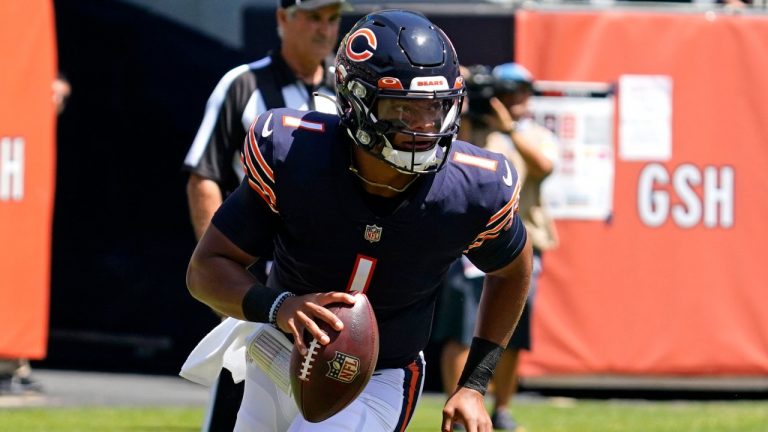 Chicago Bears quarterback Justin Fields runs with the ball during the first half of an NFL preseason football game against the Miami Dolphins in Chicago, Saturday, Aug. 14, 2021. (Nam Y. Huh/AP)