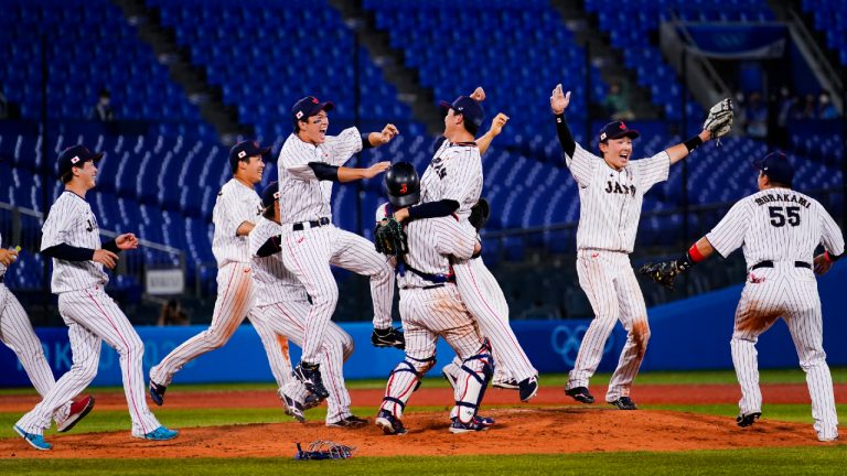 Team Japan celebrate after the gold medal baseball game against the United States at the 2020 Summer Olympics, Saturday, Aug. 7, 2021, in Yokohama, Japan. Japan won 2-0. (Matt Slocum/AP)