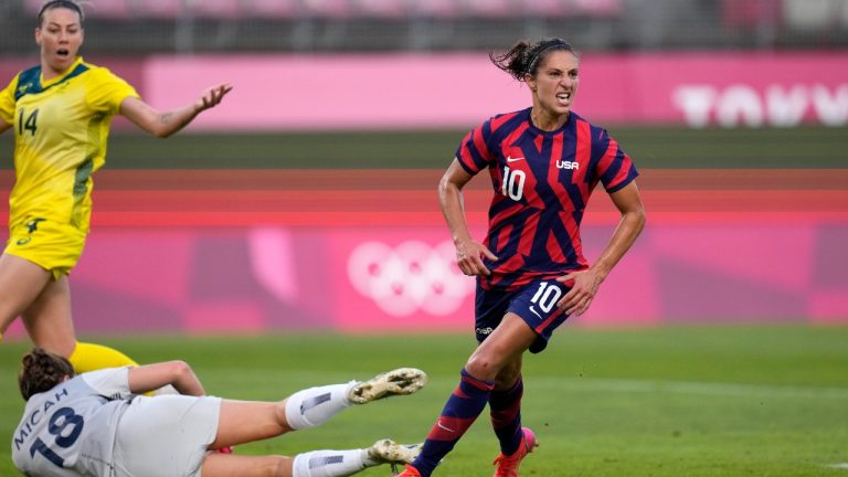 United States' Carli Lloyd, right, celebrates scoring her side's 4th goal against Australia during the women's bronze medal soccer match at the 2020 Summer Olympics, Thursday, Aug. 5, 2021, in Kashima, Japan. (Fernando Vergara/AP)