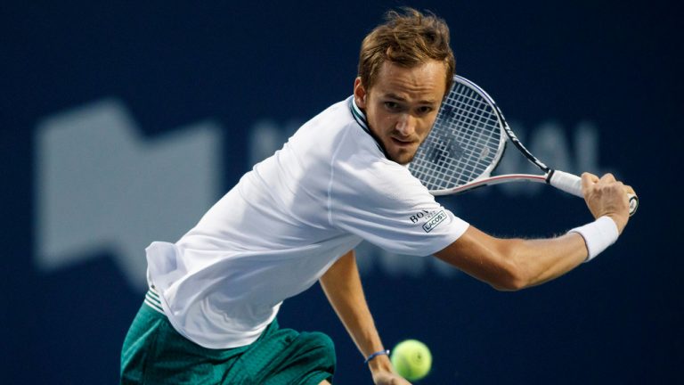 Daniil Medvedev, of Russia, returns to John Isner, of United States, during their semi-final match at the National Bank Open men's tennis in Toronto on Saturday, Aug. 14, 2021. Cole Burston/CP