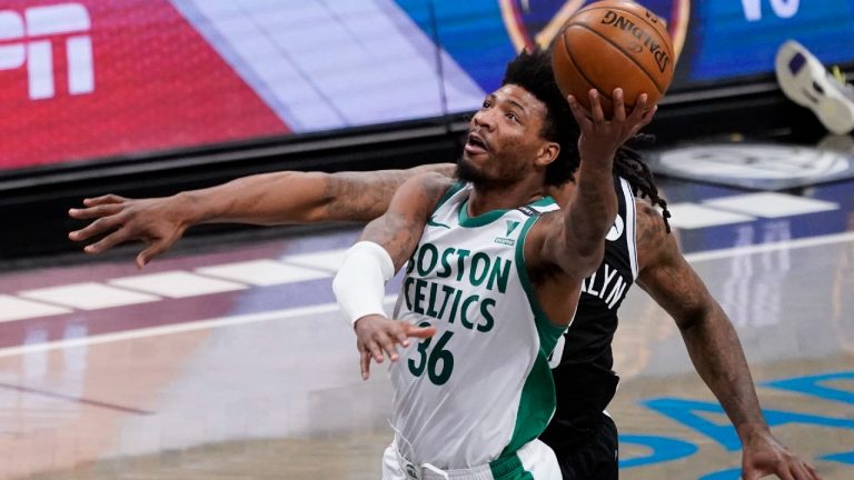 Boston Celtics guard Marcus Smart (36) goes to the basket past Brooklyn Nets centre DeAndre Jordan during the first half of an NBA basketball game, Friday, April 23, 2021, in New York. (Mary Altaffer/AP)
