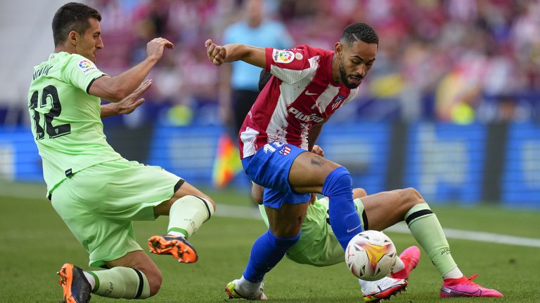 Atletico Madrid's Matheus Cunha is challenged by Athletic Bilbao's Dani Vivian, left, during a Spanish La Liga soccer match between Atletico Madrid and Athletic Bilbao at Wanda Metropolitano stadium in Madrid, Spain, Saturday, Sept. 18, 2021. (Manu Fernandez/AP)