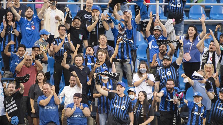 CF Montreal fans celebrate a goal during first half MLS soccer action against FC Cincinnati in Montreal. (Graham Hughes/CP)