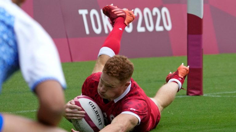 Canada's Connor Braid scores a try during their men's rugby sevens match against Japan at the 2020 Summer Olympics, Tuesday, July 27, 2021 in Tokyo, Japan (Shuji Kajiyama/AP).
