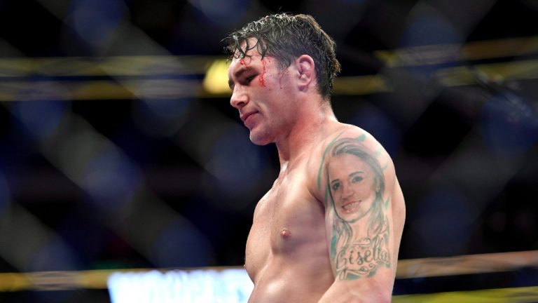 Darren Till walks back to his corner after losing by submission to Tyron Woodley in their welterweight title mixed martial arts bout at UFC 228 on Saturday, Sept. 8, 2018, in Dallas. (Jeffrey McWhorter/AP).